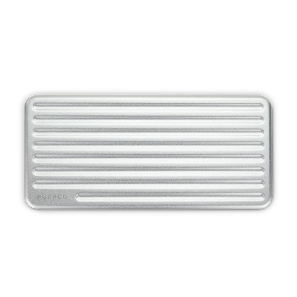 Open view of PuffCo Pivot storage case showing silicone compartments for dab tools and swabs