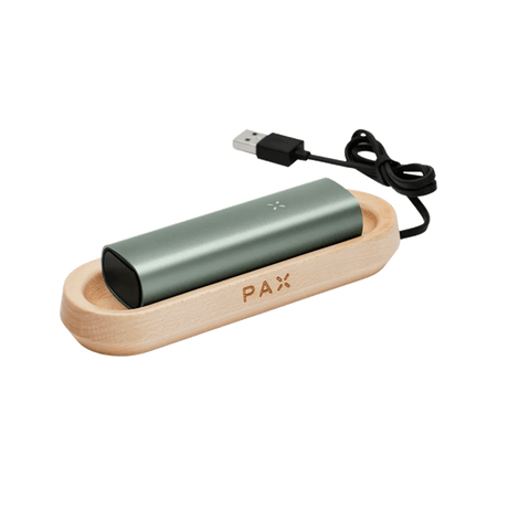 Wooden charging tray for PAX vaporizer in sleek modern design.